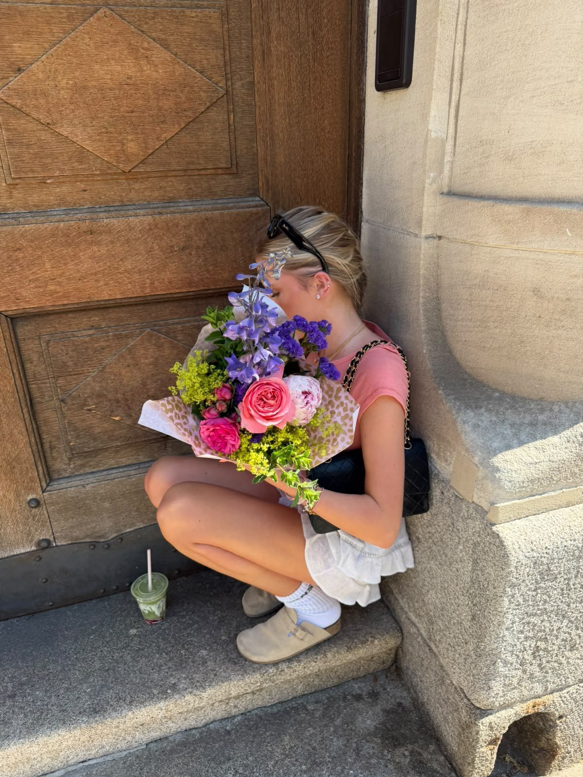 Milla with a bouquet of flowers